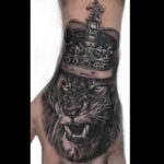 Lion and crown realistic tattoo portrait