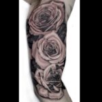 Black and grey Roses on the inner arm