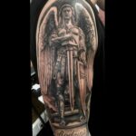 arch angel tattoo with sword black and grey tattoo