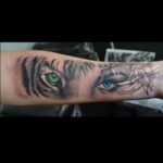 Realistic tiger and woman face tattoo