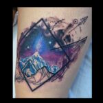 Colour realism mountain and geometric line work tattoo